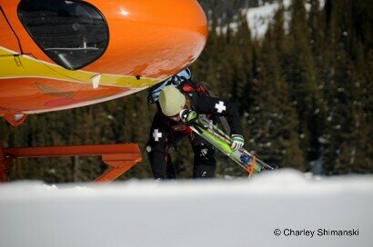Ski Patroller at nose of Helicopter